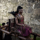 Queen Njinga being carried on a throne